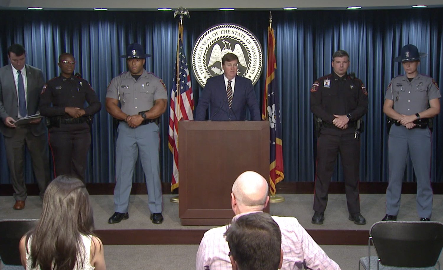 Gov. Tate Reeves, flanked by state law enforcement officials, unveils a plan to help reduce crime in Jackson last week.